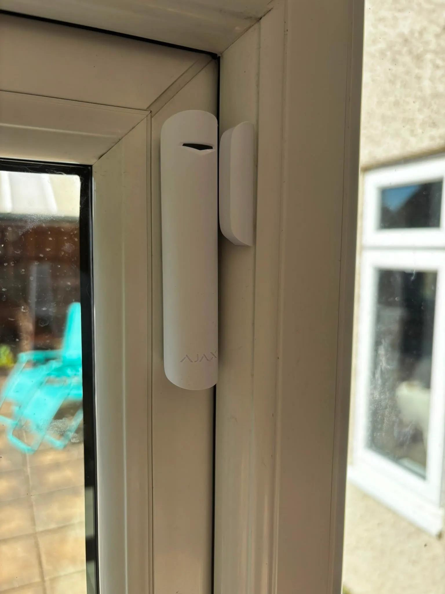 Ajax door contact protecting a conservatory door onto the garden.