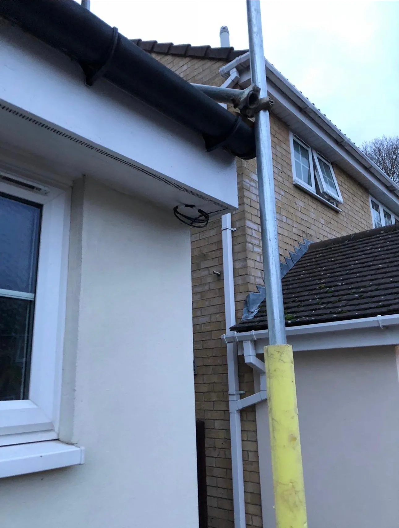 Weatherproof external cable ducting routed neatly along the roofline and down the wall.