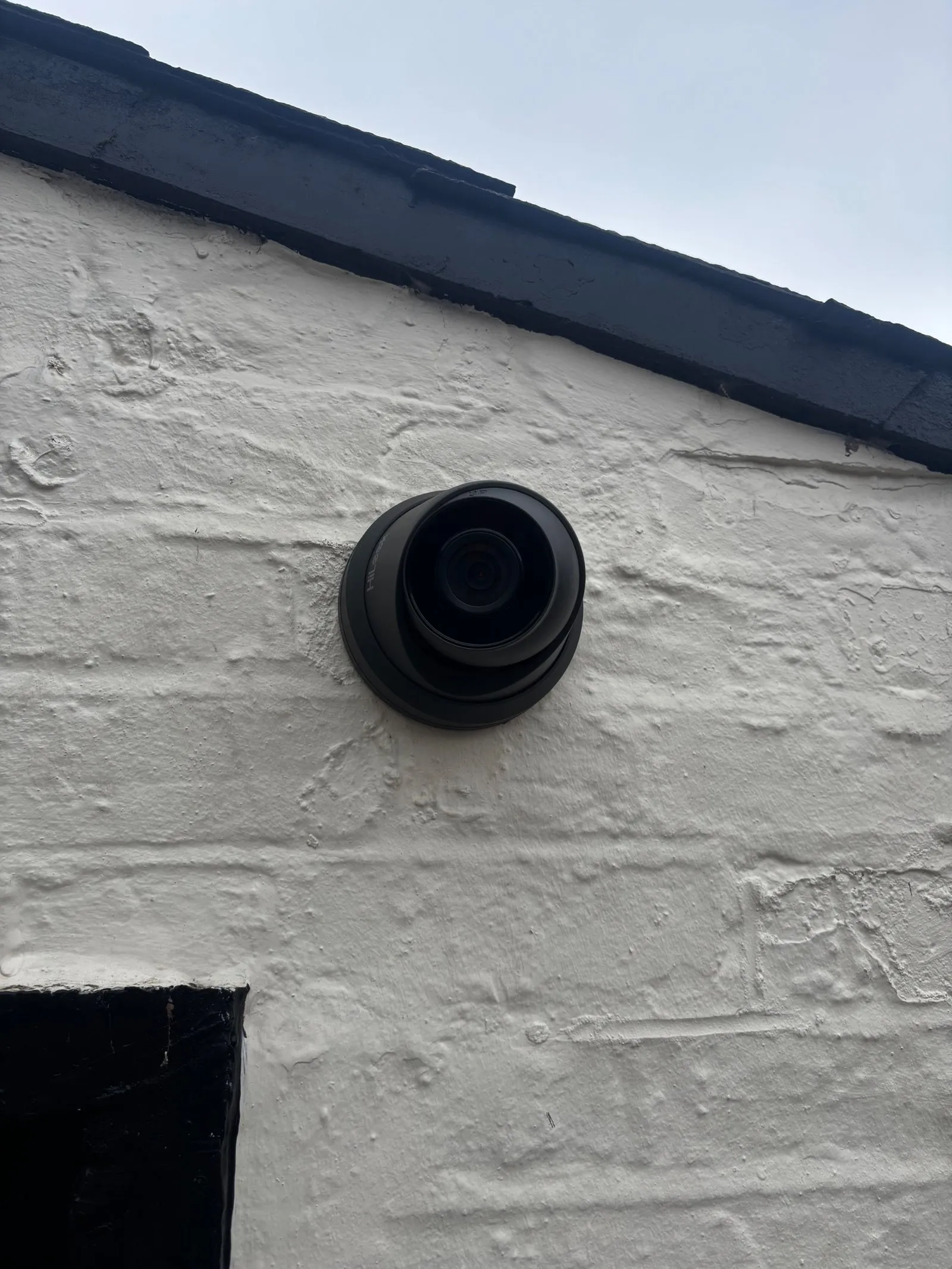 Discreet gable-mounted turret CCTV for full frontage coverage.