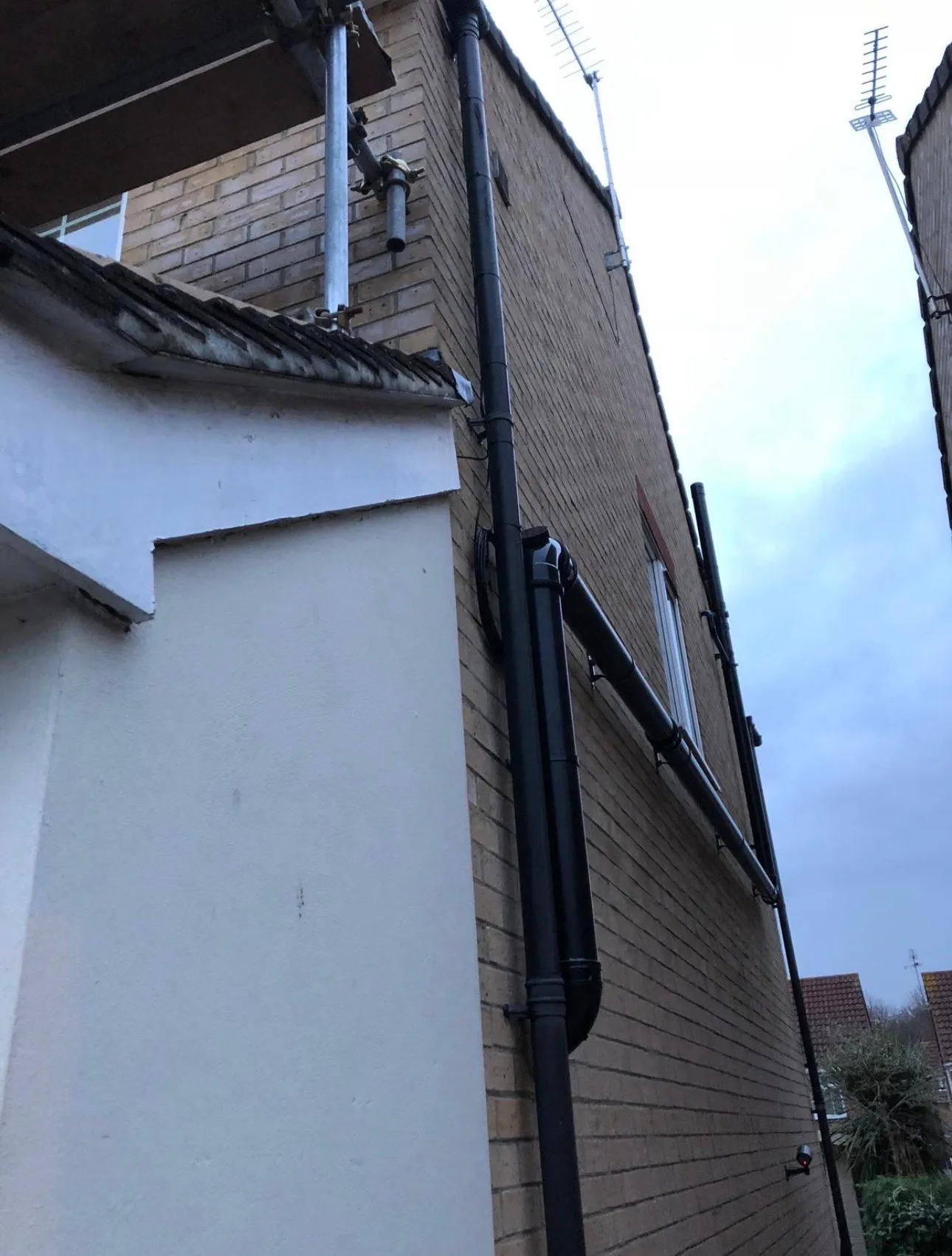 Discreet external ducting carrying data cabling cleanly up and along the building exterior.