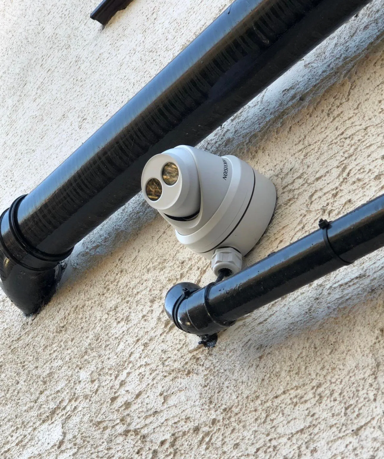 Tidy dual-camera installation worked cleanly around existing guttering.