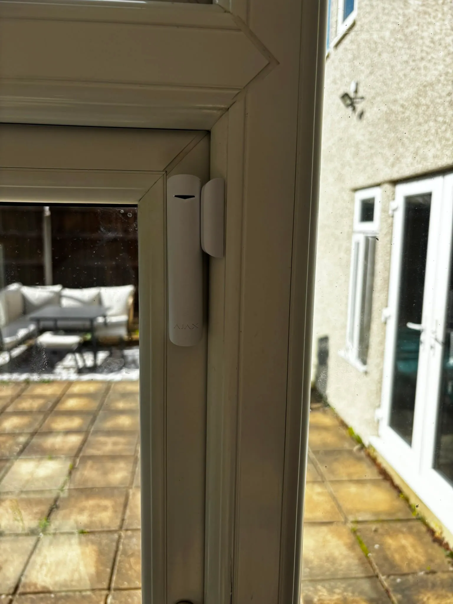 Ajax door contact fitted to a rear door leading onto the patio.
